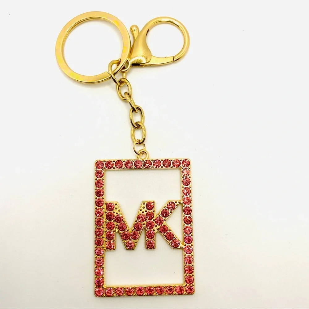 Purse Charm Key Chain MK Pink Crystals set in golden tone. BRAND NEW
